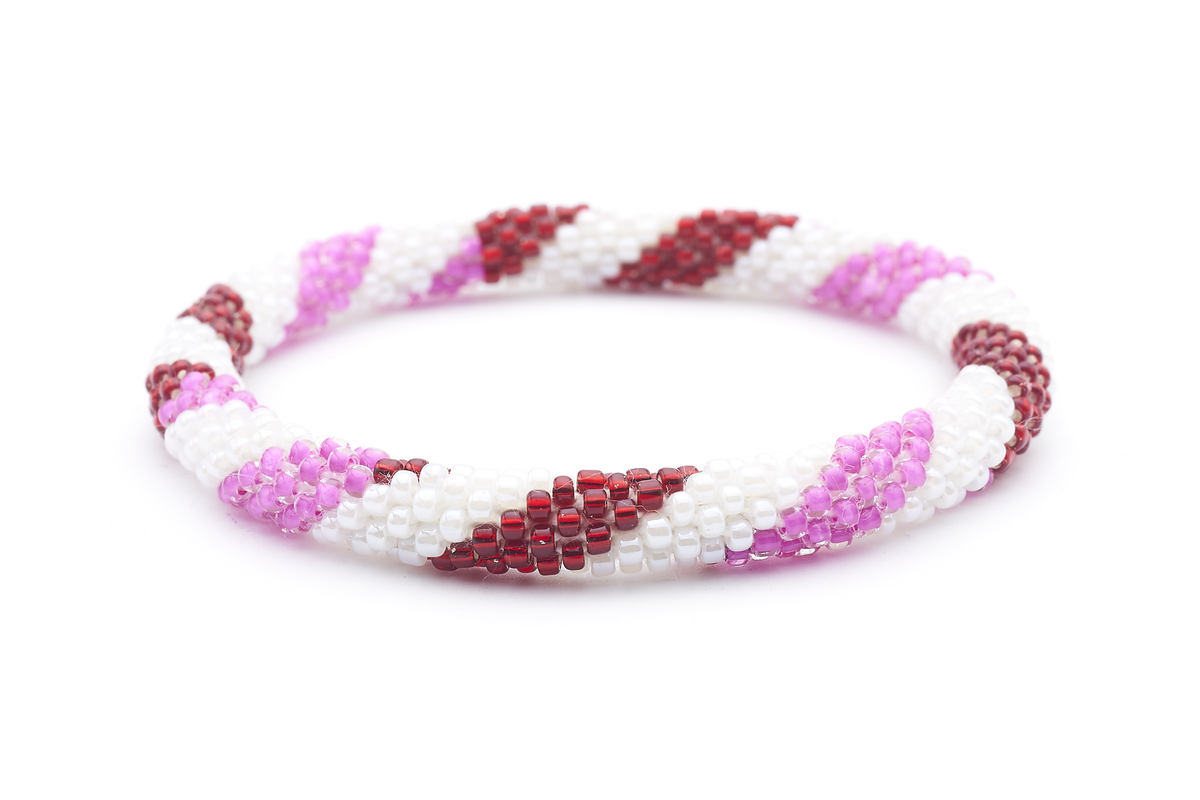 Sashka Co. handmade glass beaded friendship bracelet with red, white, and pink glass beads in a spiral pattern. Crafted in Nepal by skilled artisans.