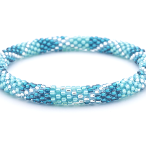 Sashka Co handmade beaded friendship bracelet with teal, aqua, and clear glass beads. Crafted in Nepal by skilled artisans.