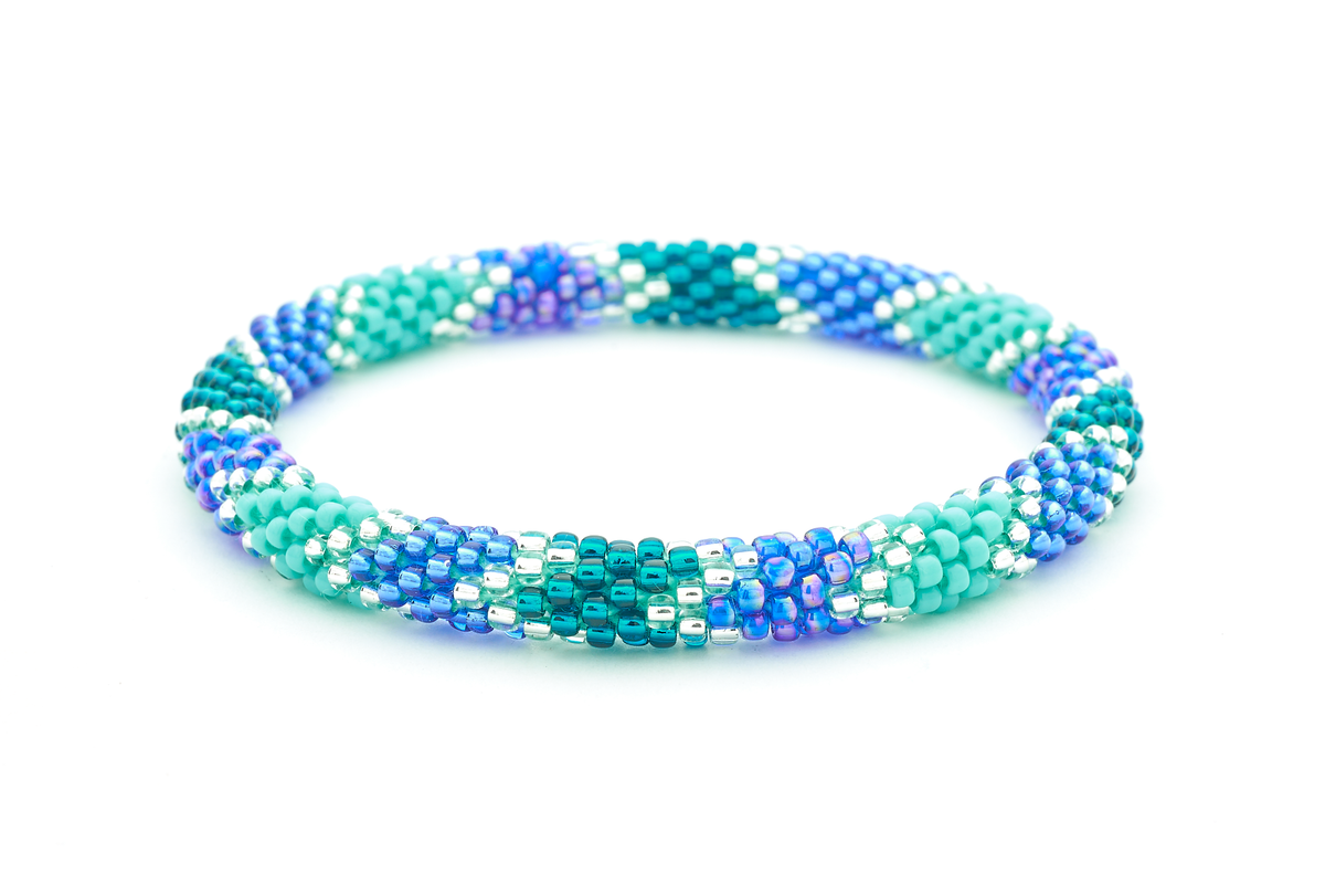 Sashka Co handmade beaded friendship bracelet with teal, turquoise, clear, and blue glass beads. Crafted in Nepal by skilled artisans.