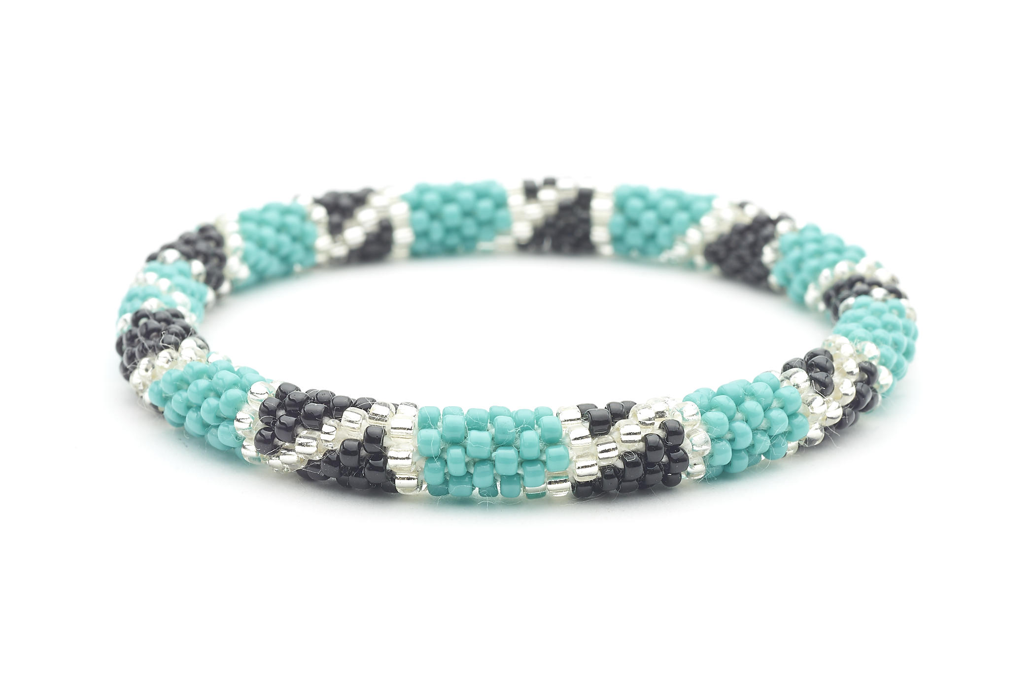 Sashka Co handmade beaded friendship bracelet with turquoise, black, and clear glass beads in a block spiral design. Crafted in Nepal by skilled artisans.

