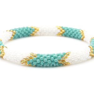 Sashka Co handmade beaded friendship bracelet with turquoise, white, and gold glass beads in a chevron design. Crafted in Nepal by skilled artisans.
