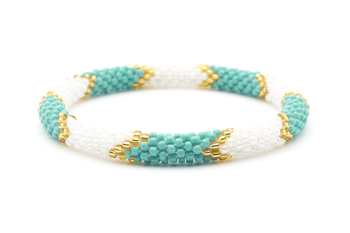 Sashka Co handmade beaded friendship bracelet with turquoise, white, and gold glass beads in a chevron design. Crafted in Nepal by skilled artisans.