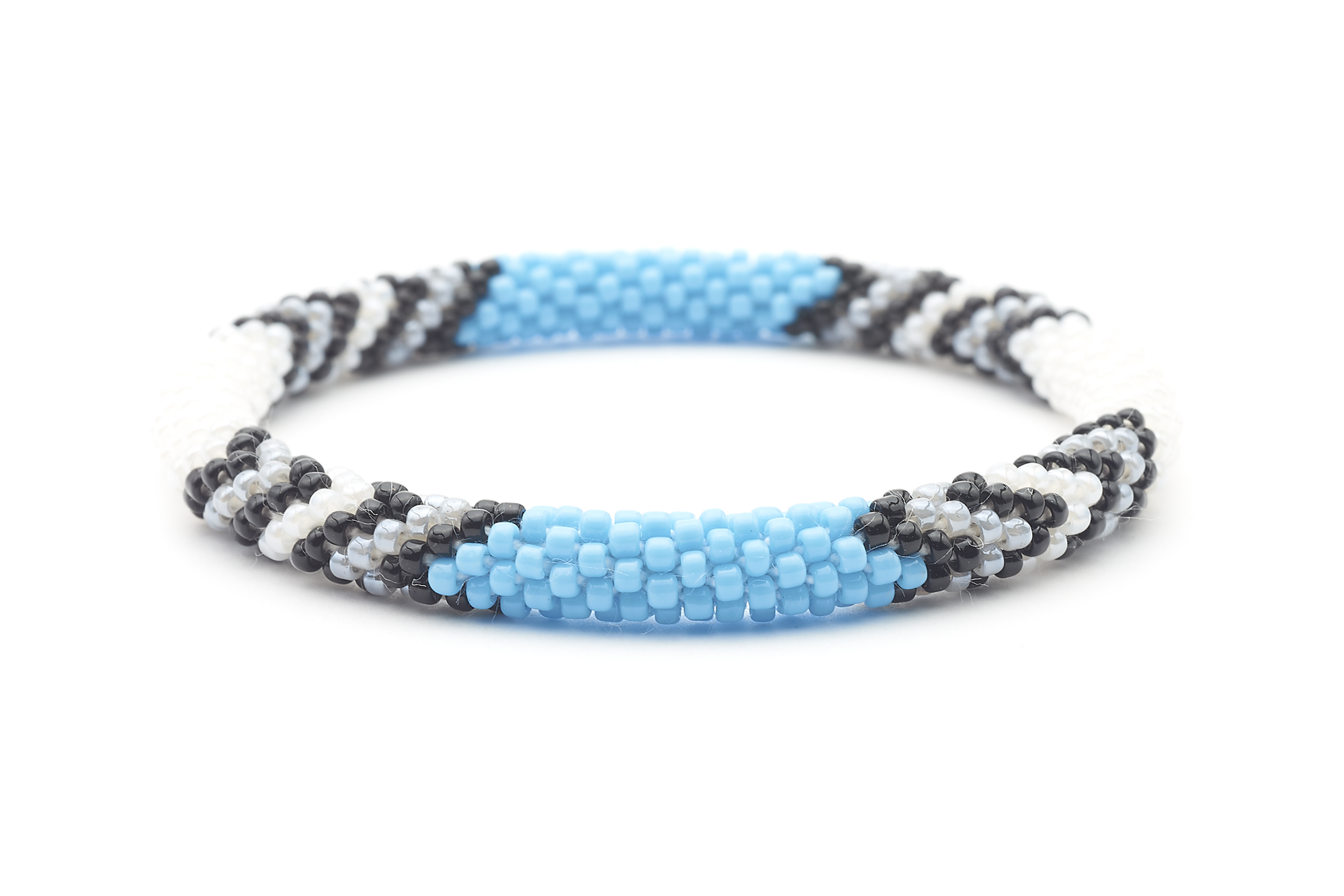 Sashka Co. handmade glass beaded friendship bracelet with white, black, gray, and baby blue beads in a chevron arrow pattern. Crafted in Nepal by skilled artisans.