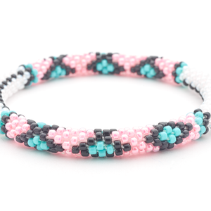 Sashka Co. handmade glass beaded friendship bracelet with white, black, pink, and turquoise glass beads. Crafted in Nepal by skilled artisans.