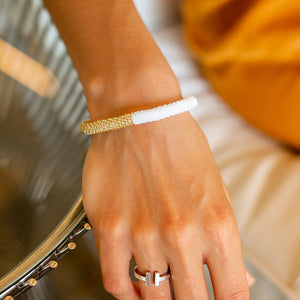 Sashka Co handmade beaded friendship bracelet with white and champagne gold glass beads. Crafted in Nepal by skilled artisans.