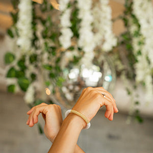 Sashka Co handmade beaded friendship bracelet with white and champagne gold glass beads. Crafted in Nepal by skilled artisans.