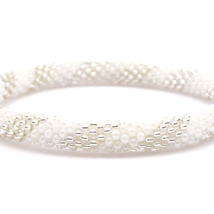 Sashka Co. handmade glass beaded friendship bracelet with white and clear glass beads in a spiral pattern. Crafted in Nepal by skilled artisans.