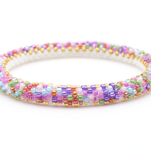 Sashka Co handmade beaded friendship bracelet with white and mixed gold glass beads. Crafted in Nepal by skilled artisans.