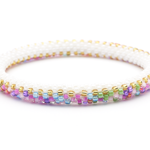 Sashka Co handmade beaded friendship bracelet with white and mixed gold glass beads. Crafted in Nepal by skilled artisans.