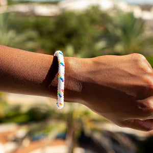 Sashka Co handmade beaded friendship bracelet with white and rainbow spiral glass beads. Crafted in Nepal by skilled artisans.