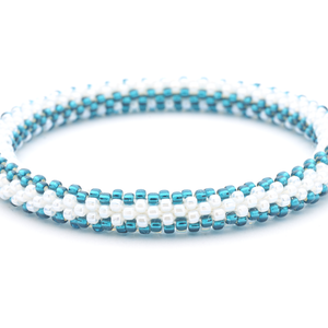 Sashka Co. handmade beaded friendship bracelet with white and teal glass beads. Crafted in Nepal by skilled artisans in a zipper pattern.
