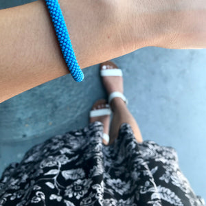 Sashka Co handmade beaded friendship bracelet with solid baby blue glass beads. Fair trade and artisan-made in Nepal.
 