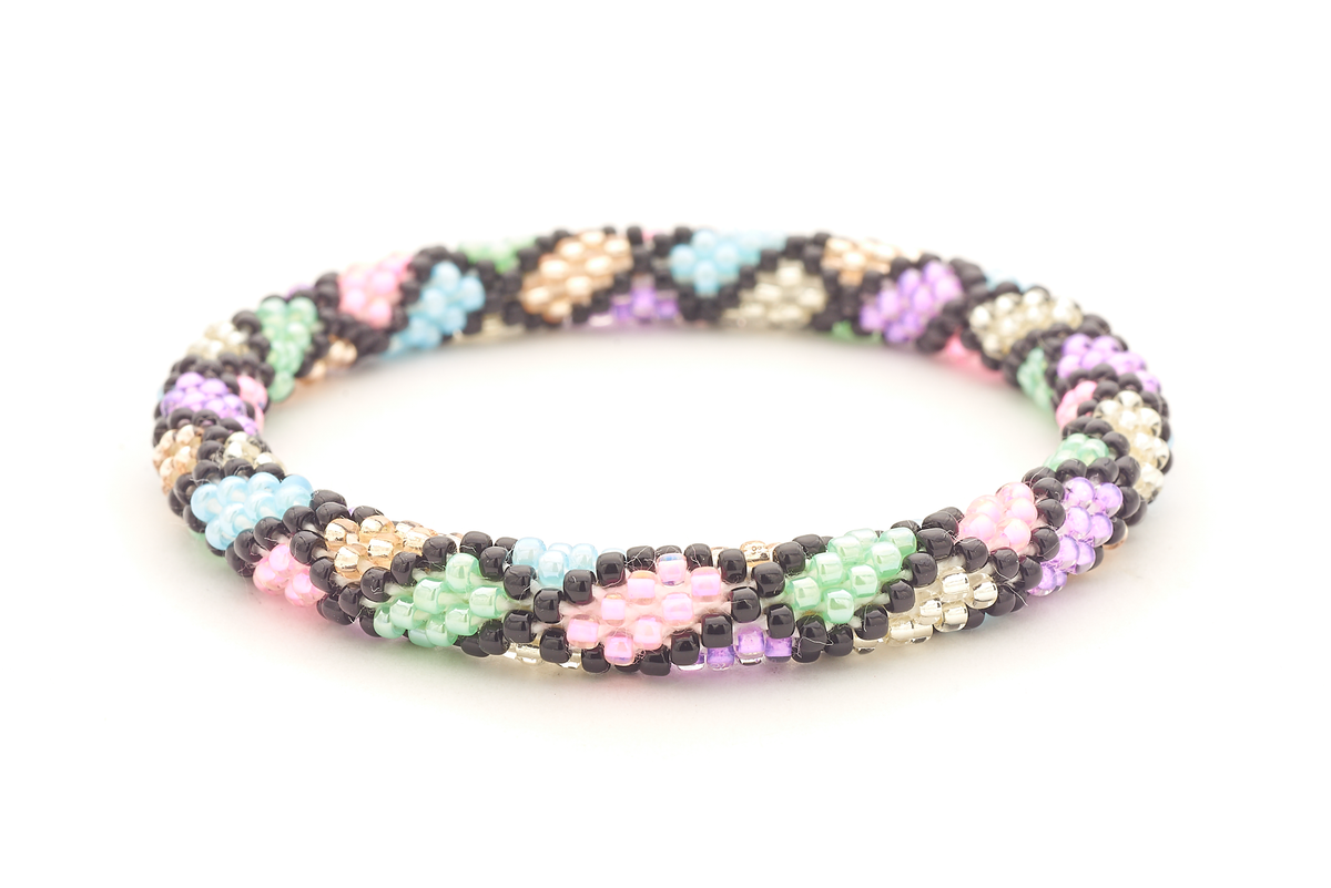 Sashka Co handmade beaded friendship bracelet with black, light blue, light pink, purple, light green, rose gold, and clear glass beads. Crafted in Nepal by skilled artisans in a lattice pattern.

