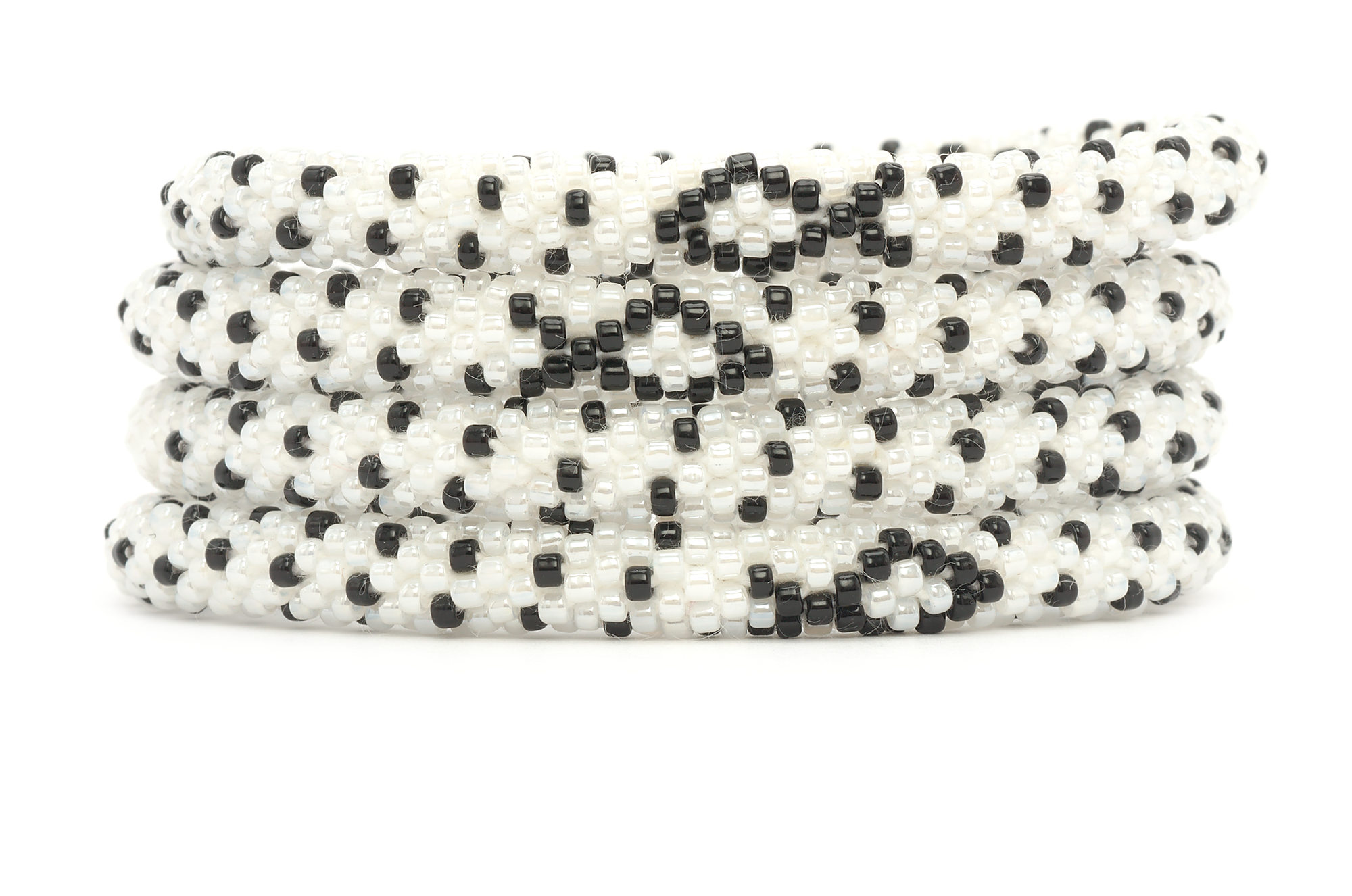 Sashka Co handmade beaded friendship bracelet with black and white glass beads. Crafted in Nepal by skilled artisans in a detailed ribbon pattern.