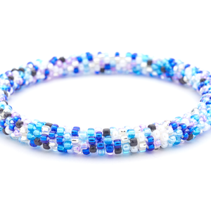 Sashka Co handmade beaded friendship bracelet with blue, black, light purple, white, and clear glass beads. Crafted in Nepal by skilled artisans.