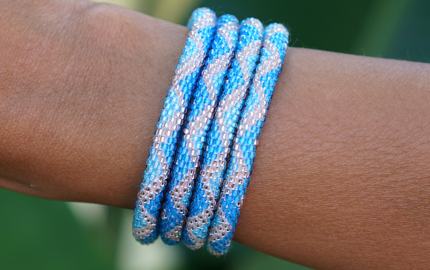Sashka Co handmade beaded friendship bracelet with blue, light blue, and rose gold glass beads. Crafted in Nepal by skilled artisans.