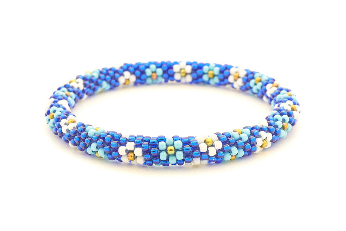 Sashka Co handmade beaded friendship bracelet with blue, light blue, white, and iridescent glass beads. Crafted in Nepal by skilled artisans.