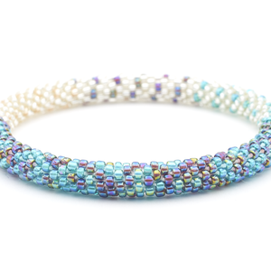 Sashka Co handmade beaded friendship bracelet with clear, blue, and purple glass beads. Crafted in Nepal by skilled artisans.