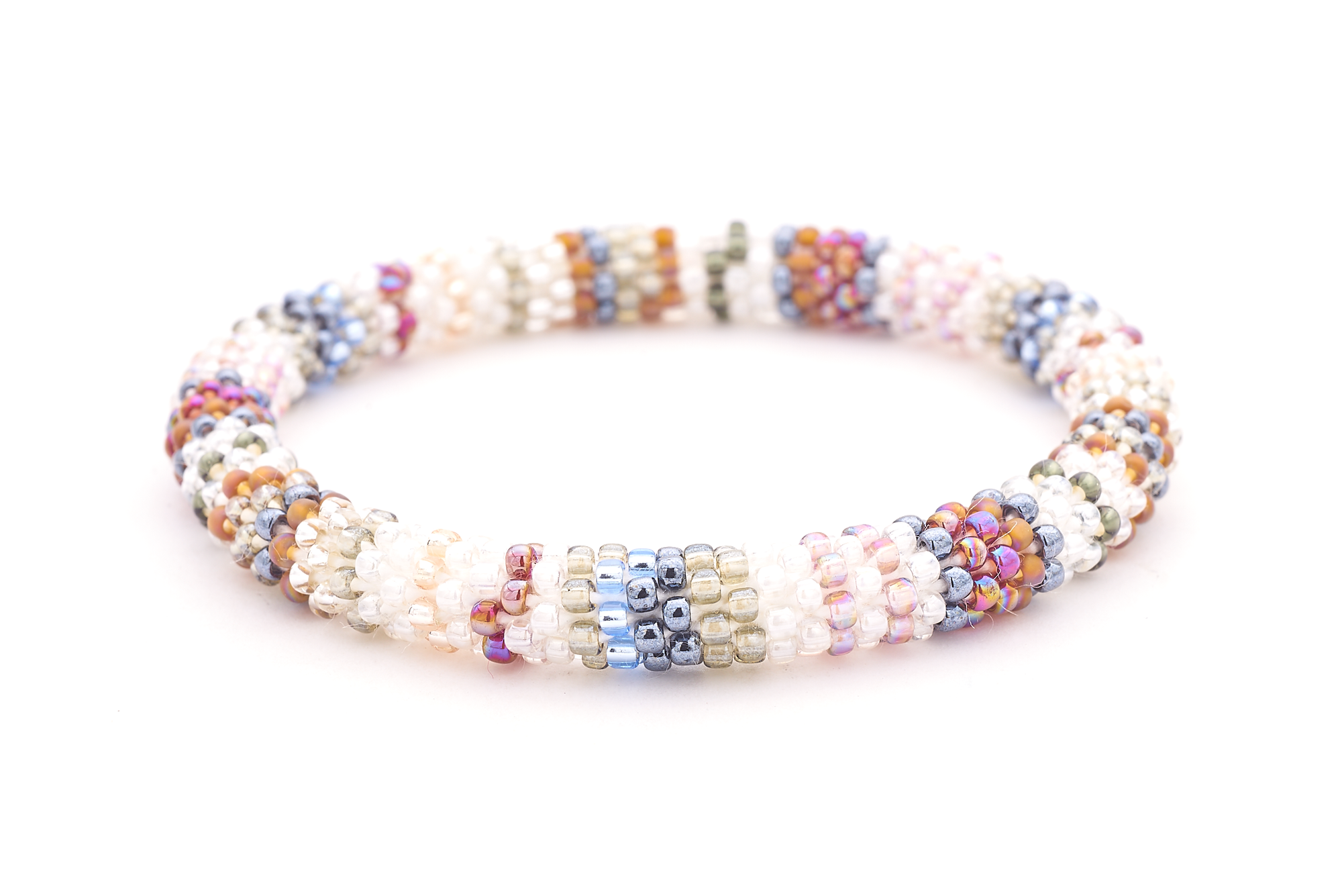 Sashka Co handmade beaded friendship bracelet with clear, silver, mauve, white, blue, red, and pink line pattern. Crafted in Nepal by skilled artisans.