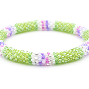 Sashka Co handmade beaded friendship bracelet with green, pink, purple, clear, and white glass beads. Crafted in Nepal by skilled artisans.