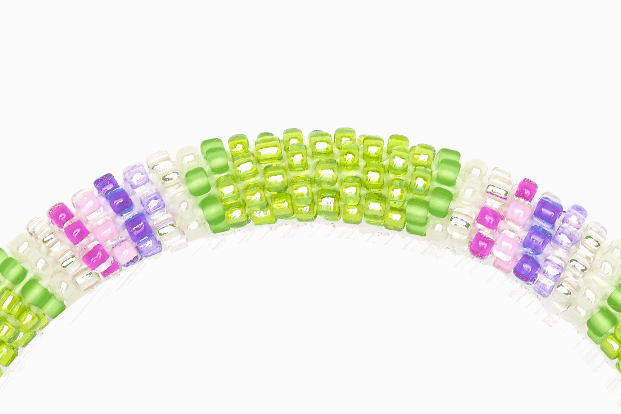 Sashka Co handmade beaded friendship bracelet with green, pink, purple, clear, and white glass beads. Crafted in Nepal by skilled artisans.