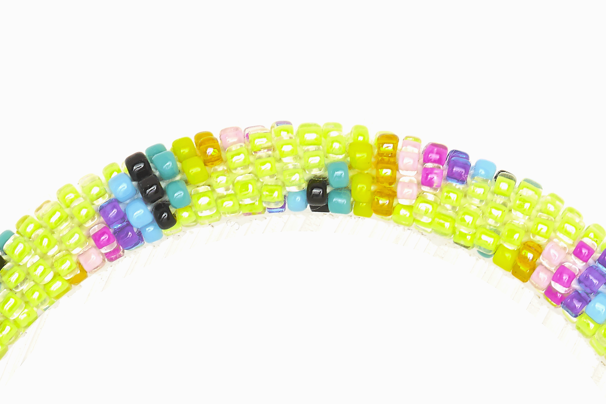 Sashka Co handmade beaded friendship bracelet with green, yellow, purple, pink, orange, blue, and black glass beads. Crafted in Nepal by skilled artisans.