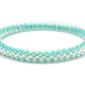 Sashka Co handmade beaded friendship bracelet with iridescent aqua and clear beads in a zipper pattern. Crafted in Nepal by skilled artisans.