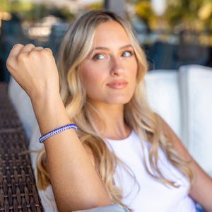 Sashka Co handmade beaded friendship bracelet with iridescent blue and clear glass beads. Crafted in Nepal by skilled artisans in a zipper pattern.