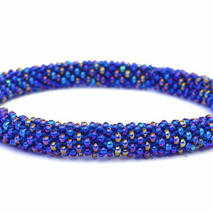 Sashka Co handmade beaded friendship bracelet with iridescent blue glass beads. Crafted in Nepal by skilled artisans in a solid pattern.