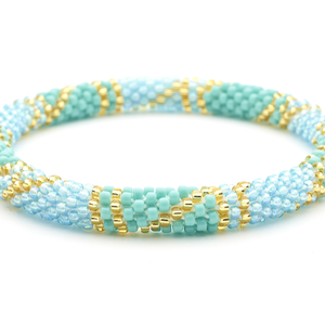 Sashka Co handmade beaded friendship bracelet with iridescent light blue, gold, and turquoise glass beads in a block spiral pattern. Made in Nepal.