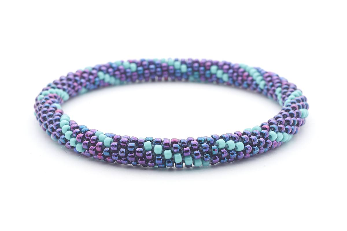 Sashka Co handmade beaded friendship bracelet with iridescent purple-blue and turquoise glass beads. Crafted in Nepal by skilled artisans in a spiral pattern.