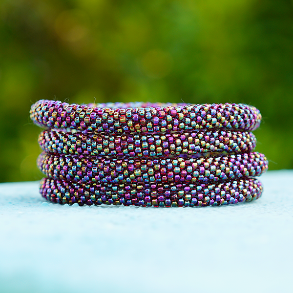 Sashka Co limited edition handmade bracelet with iridescent red glass beads. Crafted in Nepal by skilled artisans in a solid pattern.