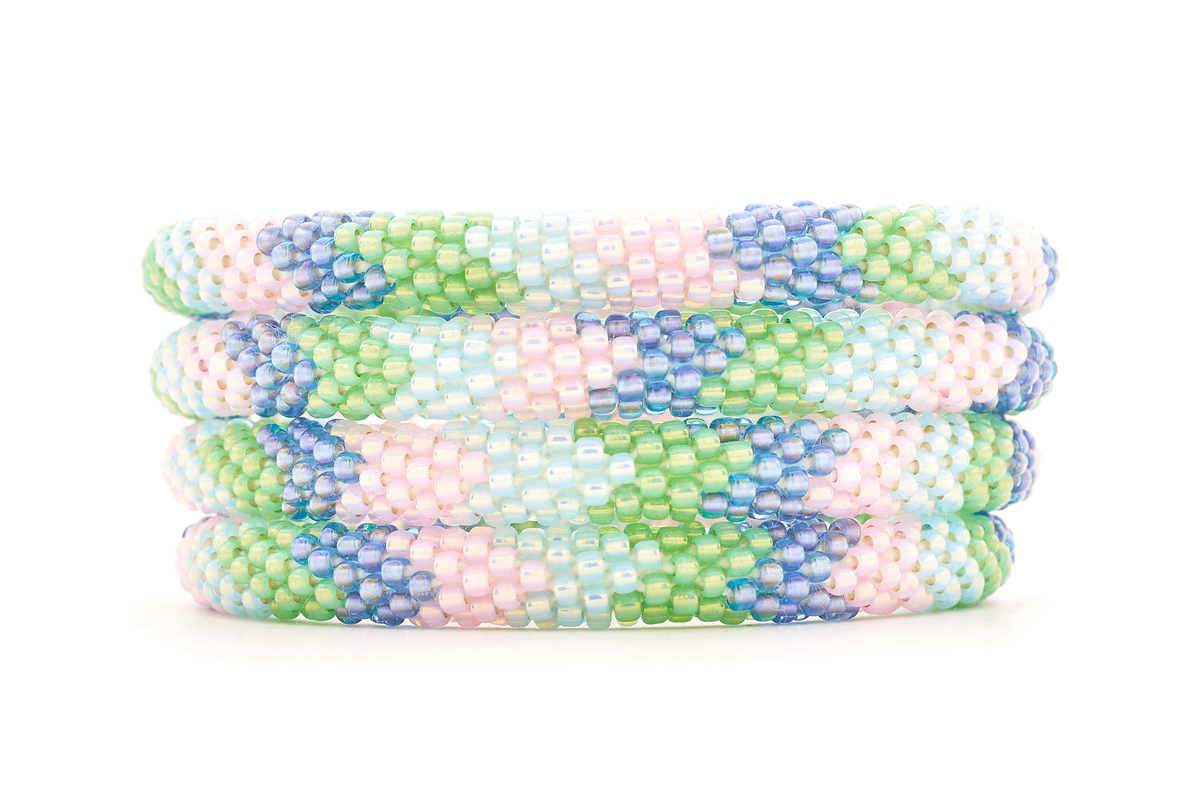 Sashka Co handmade beaded friendship bracelet with light pink, green, light blue, and iridescent purple chevron pattern. Crafted in Nepal by skilled artisans.