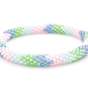 Sashka Co handmade beaded friendship bracelet with light pink, green, light blue, and iridescent purple chevron pattern. Crafted in Nepal by skilled artisans.
