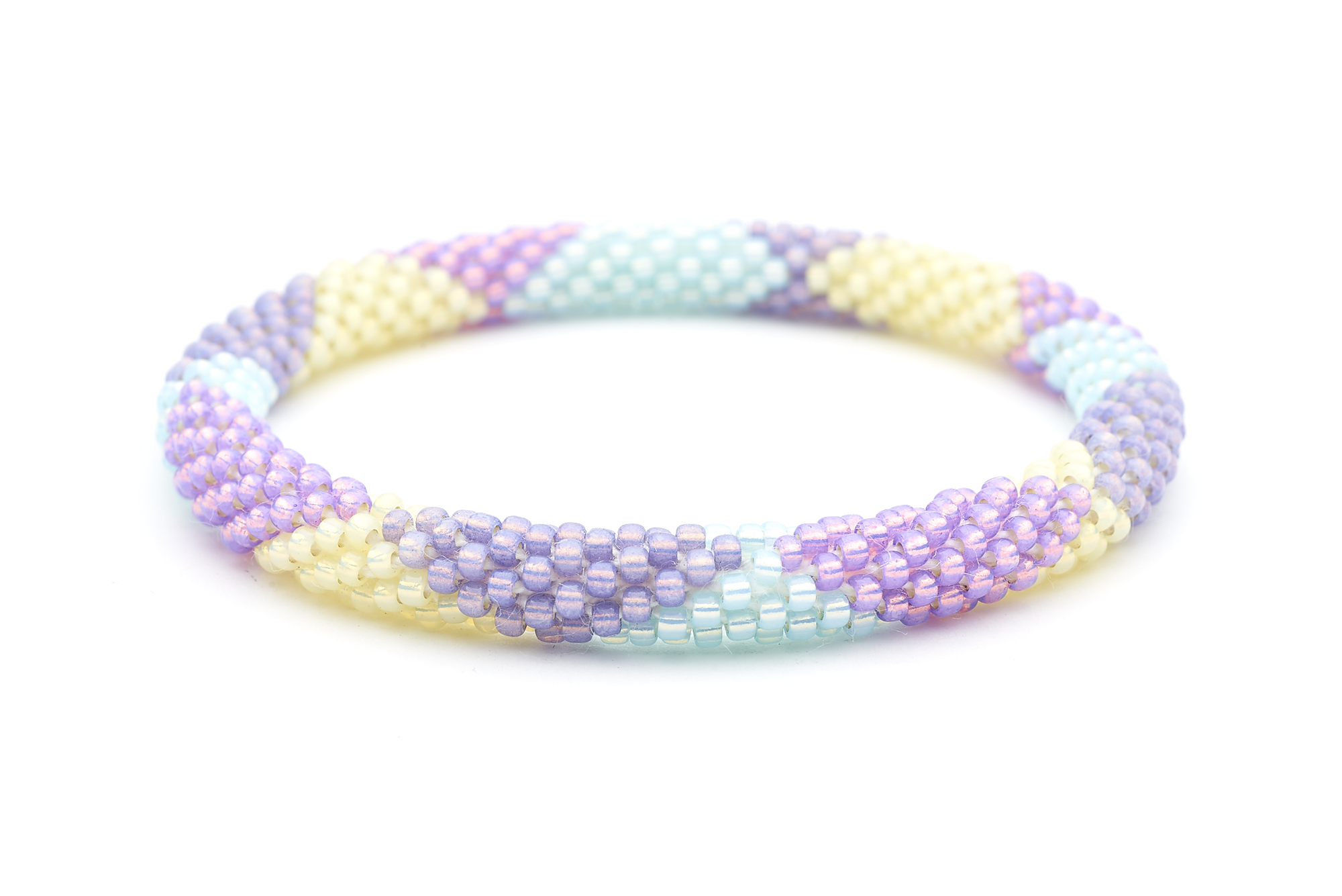 Sashka Co handmade beaded friendship bracelet with light purple, mint, purple, and pale yellow glass beads. Crafted in Nepal by skilled artisans in a large diamond pattern.