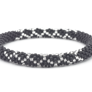 Sashka Co handmade beaded friendship bracelet with matte black and clear glass beads. Crafted in Nepal by skilled artisans in a lattice pattern.
