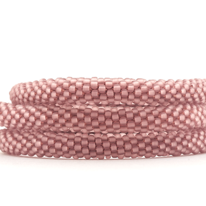 Sashka Co handmade beaded friendship bracelet with matte burgundy glass beads. Crafted in Nepal by skilled artisans in a solid pattern.