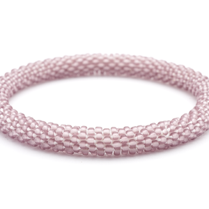 Sashka Co handmade beaded friendship bracelet with matte mauve glass beads. Crafted in Nepal by skilled artisans in a solid pattern.