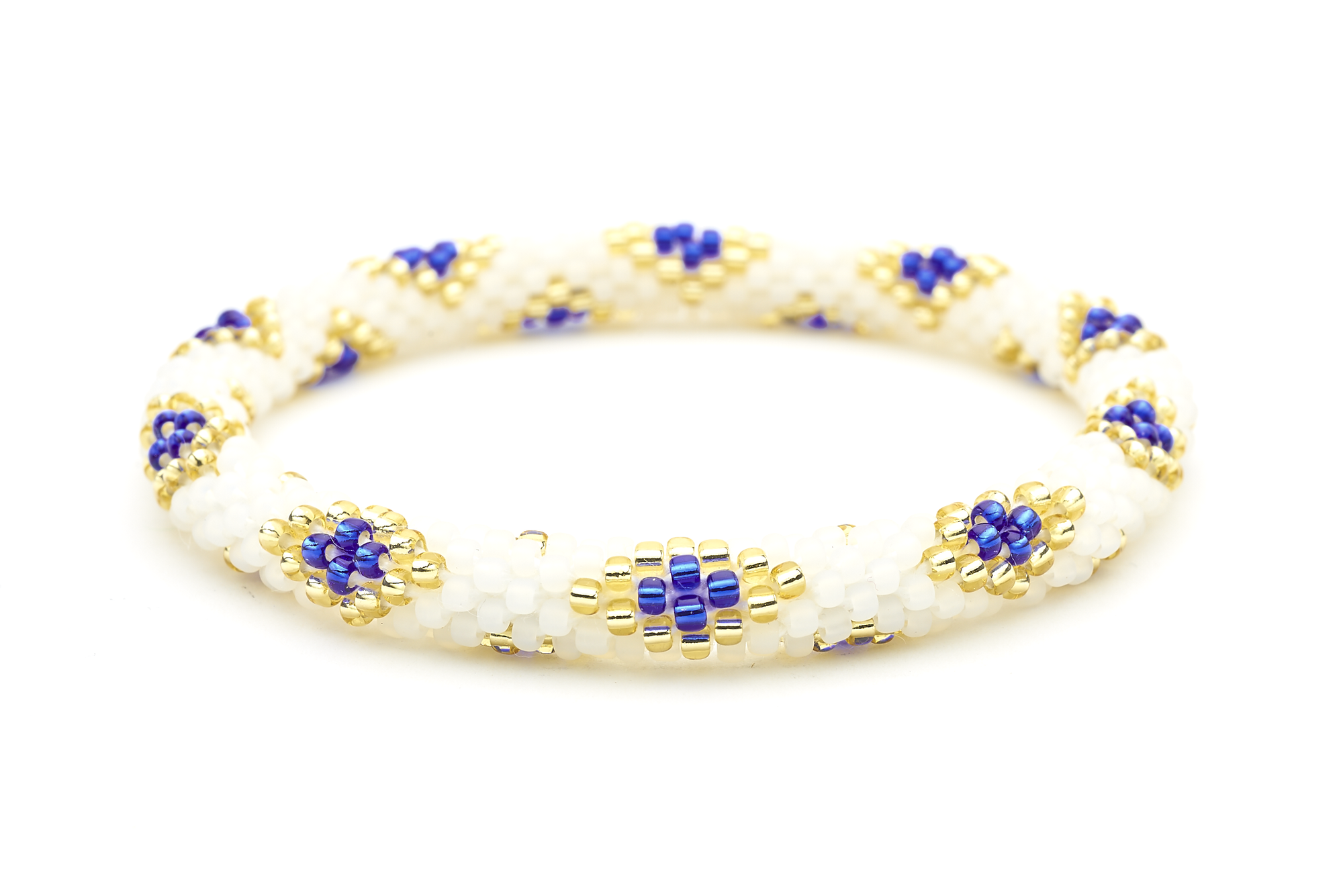 Sashka Co handmade friendship bracelet with matte white, blue, and champagne gold glass beads in a diamond pattern. Made in Nepal.