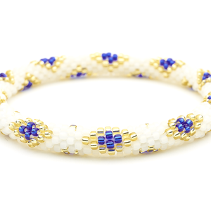 Sashka Co handmade friendship bracelet with matte white, blue, and champagne gold glass beads in a diamond pattern. Made in Nepal.
