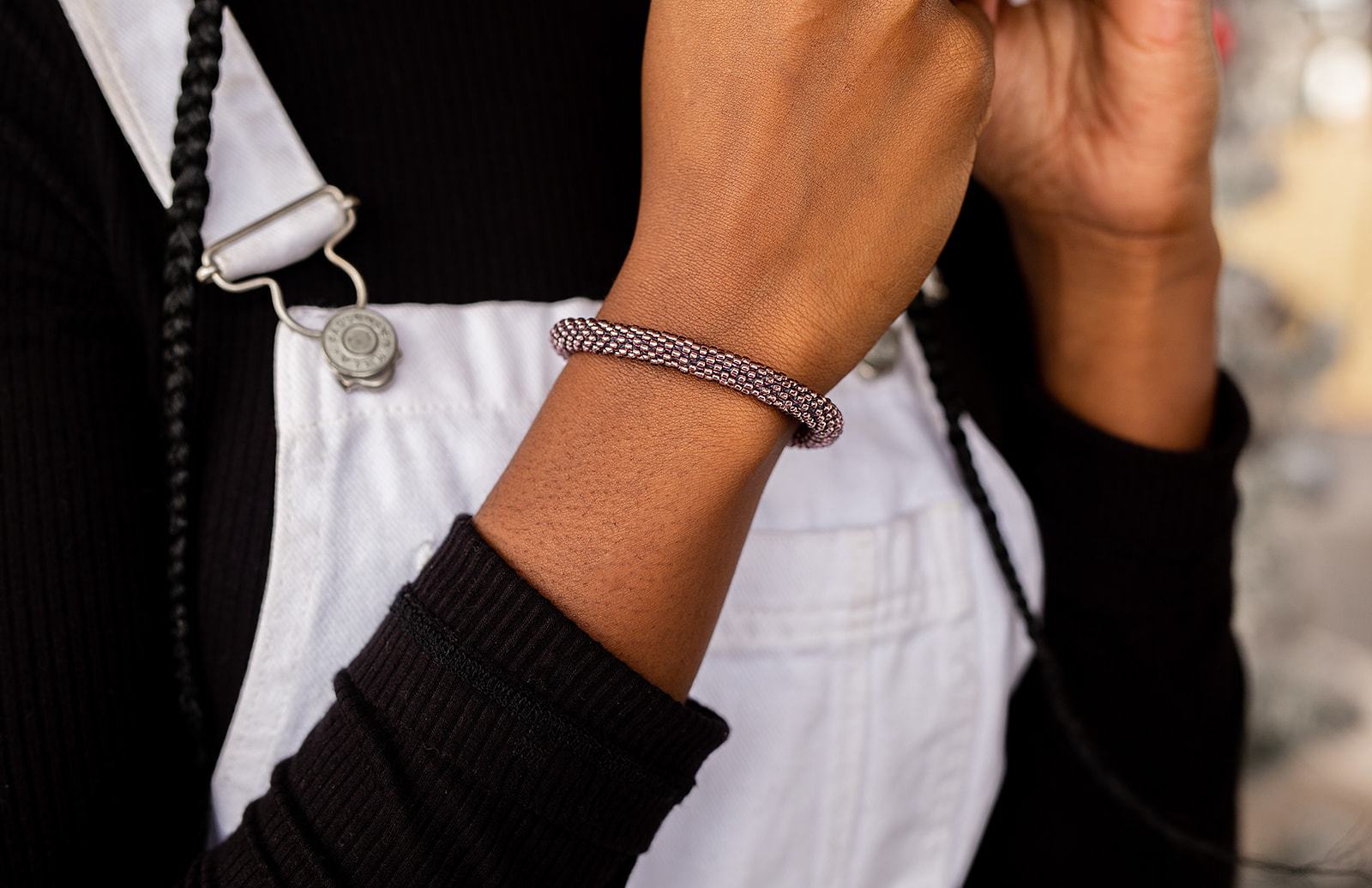 Sashka Co handmade beaded friendship bracelet with metallic purple glass beads. Crafted in Nepal by skilled artisans in a solid pattern.