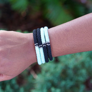 Sashka Co handmade beaded friendship bracelet in a half-and-half pattern with mint, clear, and matte black. Artisan-crafted in Nepal.
