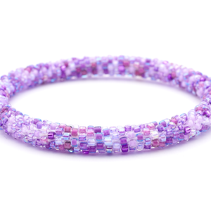Sashka Co handmade beaded friendship bracelet with mixed shades of purple glass beads. Crafted in Nepal by skilled artisans in a confetti pattern.