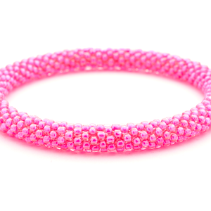 Sashka Co handmade beaded friendship bracelet with neon pink glass beads. Crafted in Nepal by skilled artisans in a solid pattern.