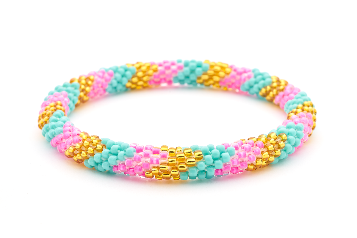 Sashka Co handmade beaded friendship bracelet with pink, gold, and turquoise glass beads. Crafted in Nepal by skilled artisans.