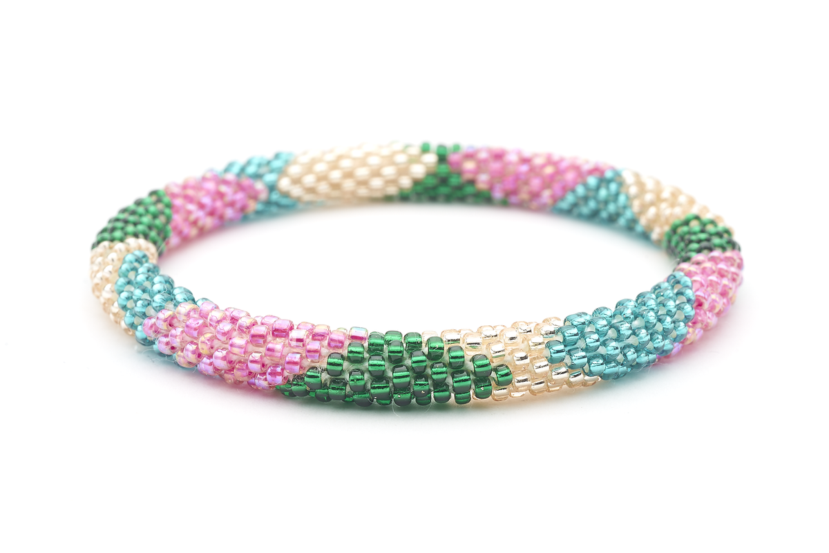Sashka Co handmade beaded friendship bracelet with pink, green, teal, and rose gold glass beads. Crafted in Nepal by skilled artisans in a large diamond pattern.