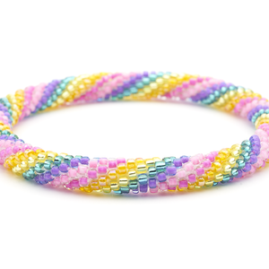 Sashka Co handmade beaded friendship bracelet with pink, purple, teal, yellow, and orange spiral pattern. Crafted in Nepal by skilled artisans.
