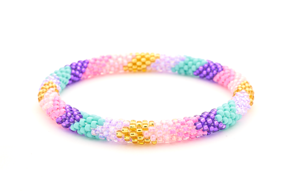 Sashka Co handmade beaded friendship bracelet with pink, purple, turquoise, and gold glass beads. Crafted in Nepal by skilled artisans in a chevron pattern.