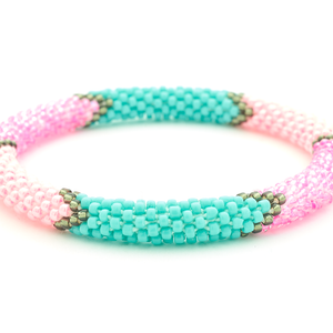 Sashka Co handmade beaded friendship bracelet with pink, turquoise, silver, and coral glass beads. Crafted in Nepal by skilled artisans.