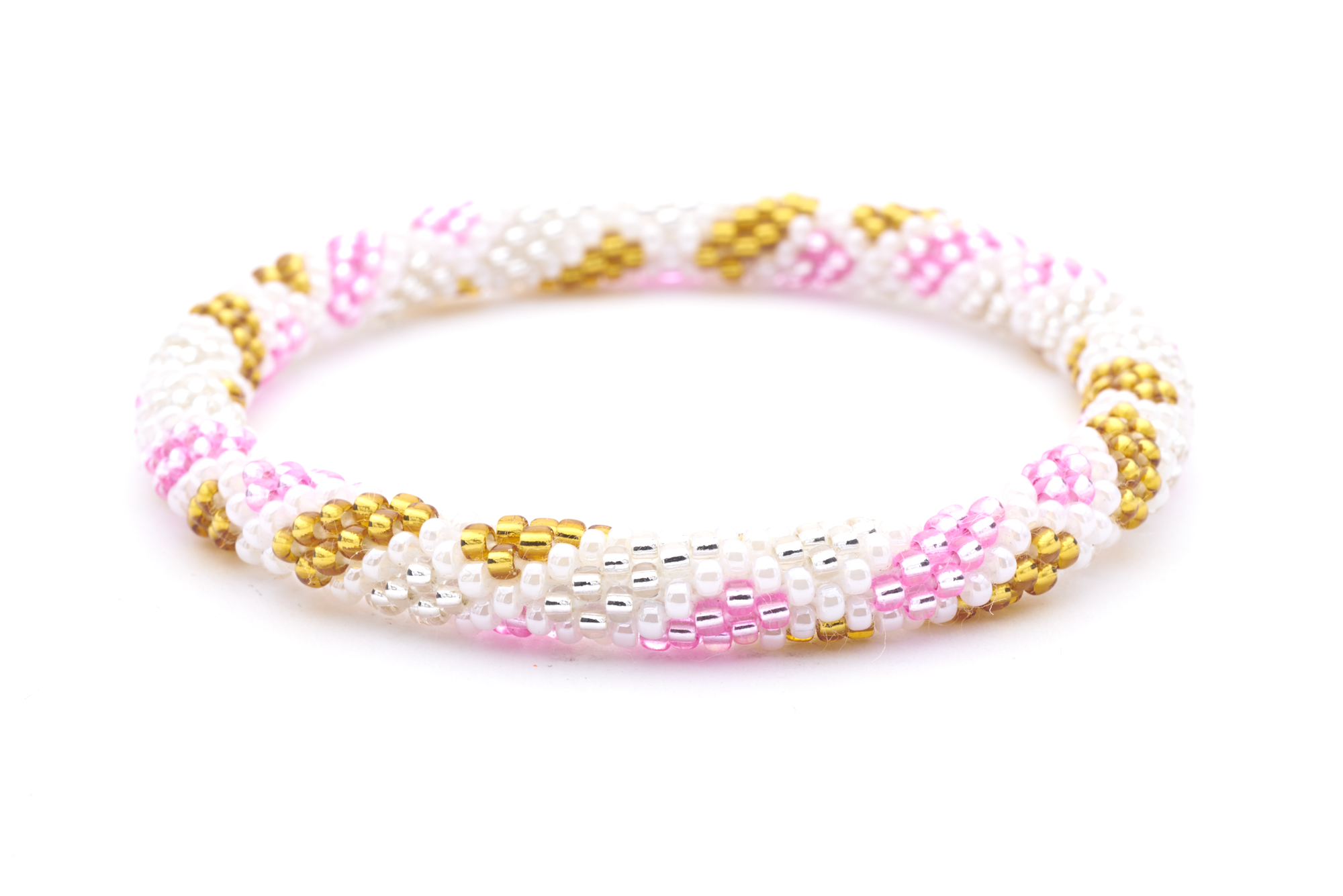 Sashka Co handmade beaded friendship bracelet with pink, white, gold, and clear criss cross spot pattern. Crafted in Nepal by skilled artisans.